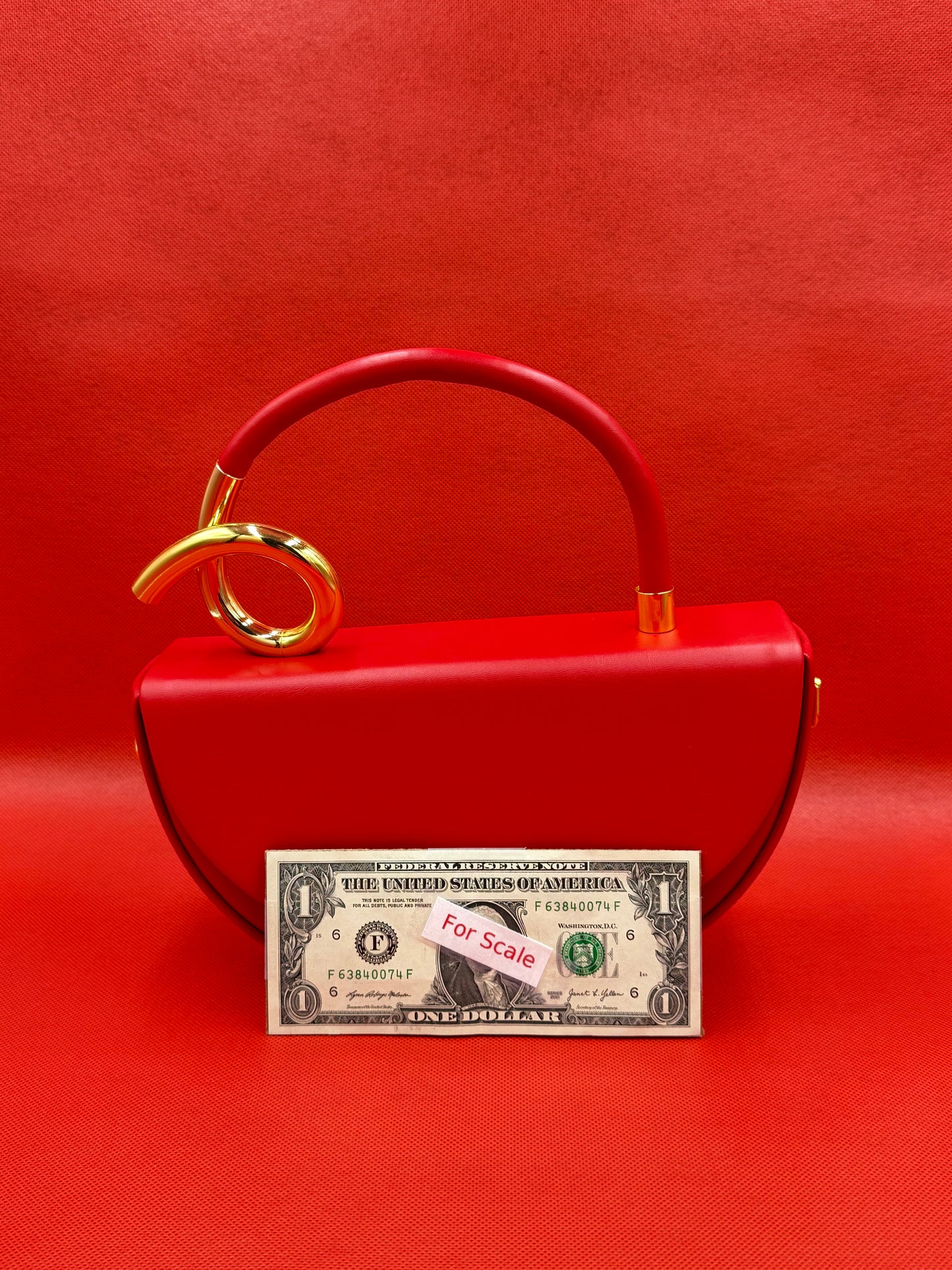 Modern Half-Moon Saddle Bag with Sculptural Gold Knot Handle & Crossbody Strap